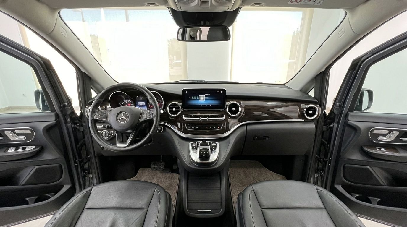 The luxurious interior of the Mercedes-Benz V-Class 250d in Benidorm, featuring the dashboard, steering wheel, and front seats.