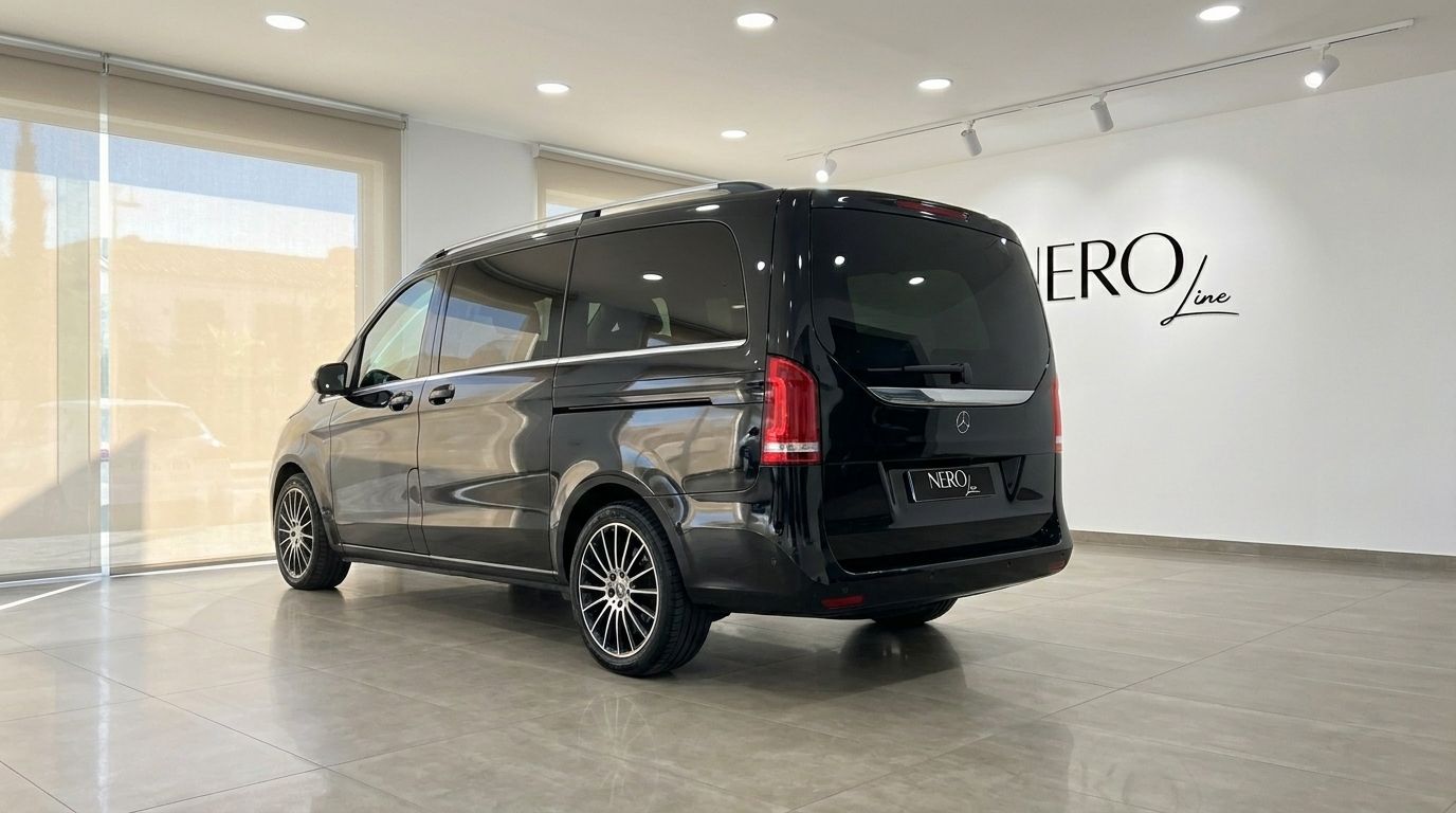 The black Mercedes-Benz V-Class 250d from 2020 is showcased from a rear three-quarter view in a showroom in Alicante.