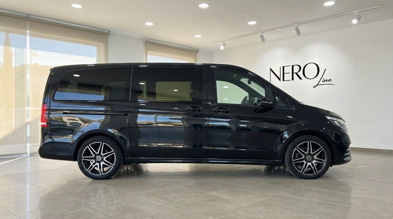 The metallic black Mercedes-Benz V250d Avantgarde is shown in a side profile view within a showroom in Marbella.