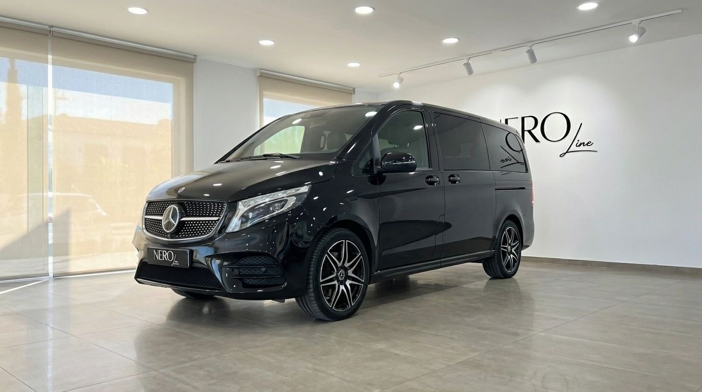 A sleek black Mercedes-Benz V250d Avantgarde luxury van is showcased from a front three-quarter view in a Marbella showroom.
