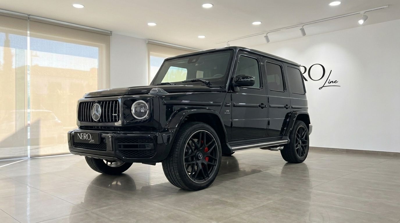 The glossy black 2025 Mercedes G63 AMG is showcased from a front three-quarter angle indoors in Madrid.