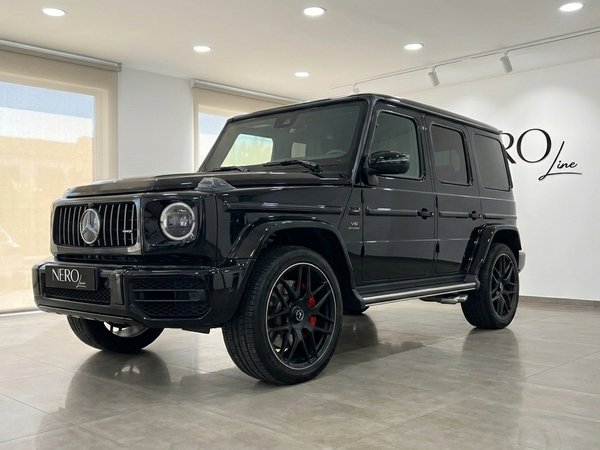 Mercedes G63 AMG — Luxury SUV in Madrid The glossy black 2025 Mercedes G63 AMG is showcased from a front three-quarter angle indoors in Madrid.