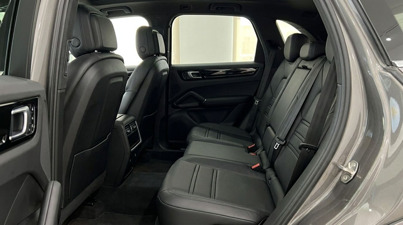 The luxurious black leather rear seats and spacious interior of the Porsche Cayenne in Mallorca.