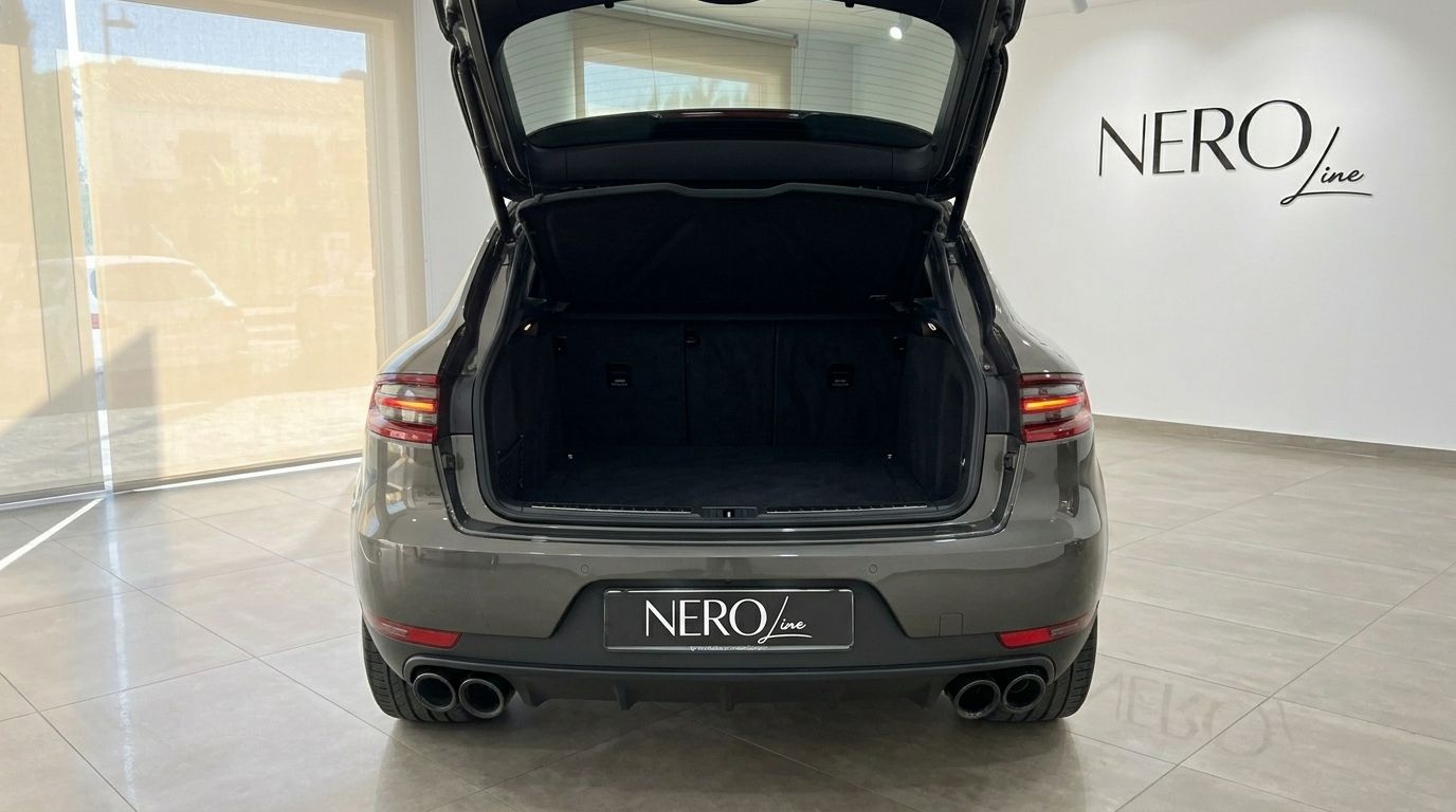 Rear view of the grey Porsche Macan 2.0 Turbo with its trunk open, showcasing the cargo space in Alicante.