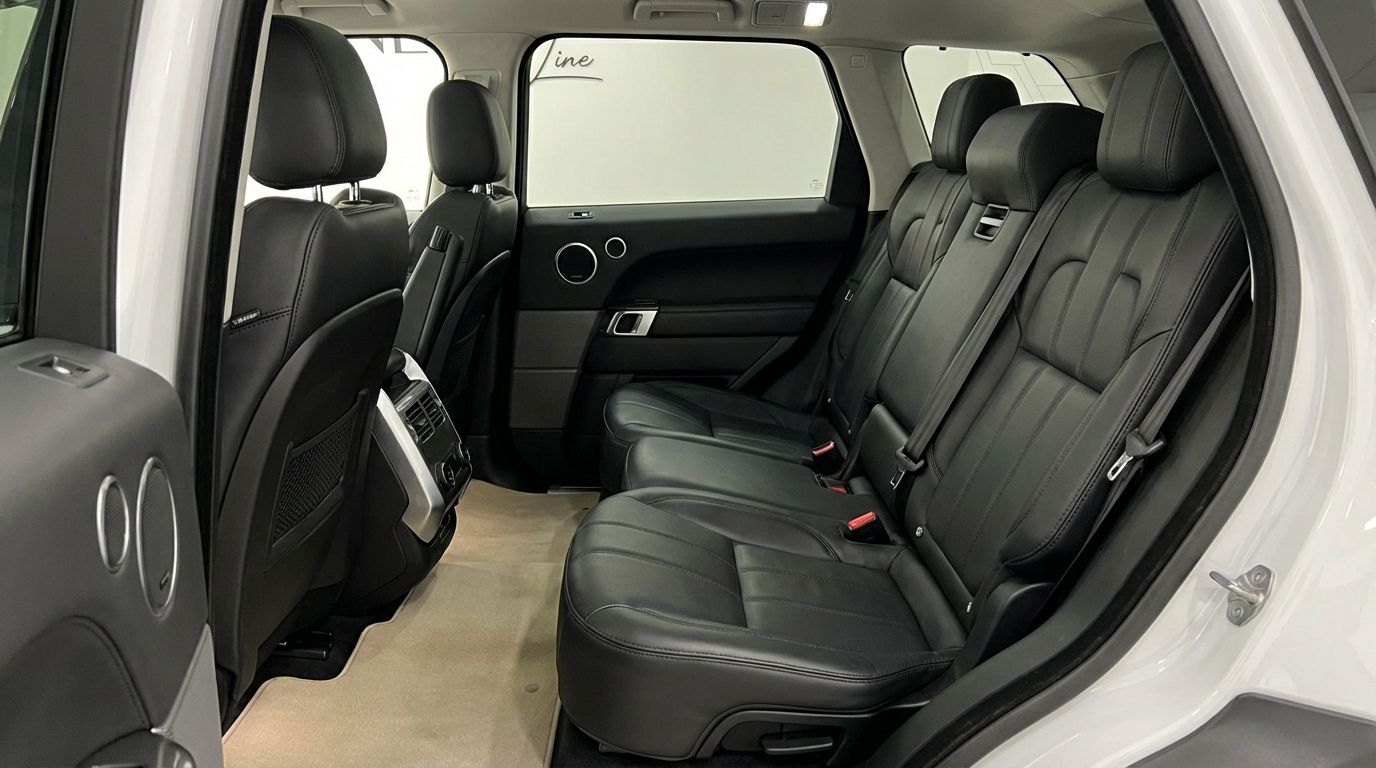 The luxurious black leather rear seats and door panel of the Range Rover Sport are visible in Barcelona.