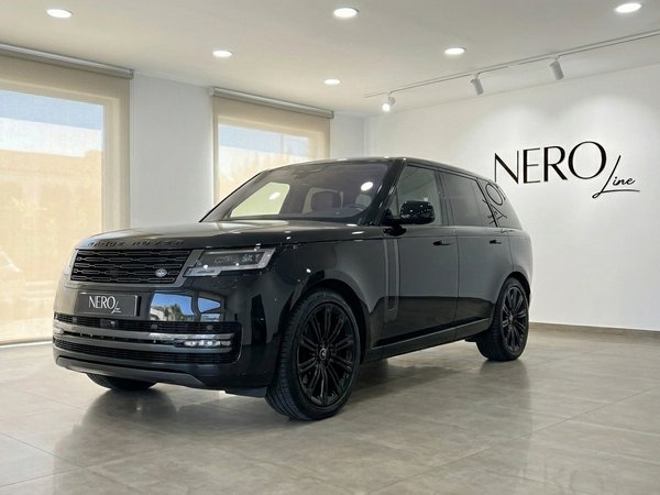 Range Rover Vogue LWB Autobiography — Marbella showroom A black 2025 Range Rover Vogue LWB Autobiography is shown from the front three-quarter angle in a Marbella showroom.