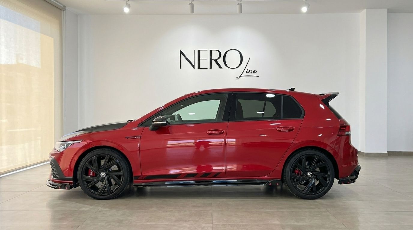 The gloss Kings Red Metallic Volkswagen Golf GTI Clubsport is shown in side profile within a showroom in Alicante, Spain.