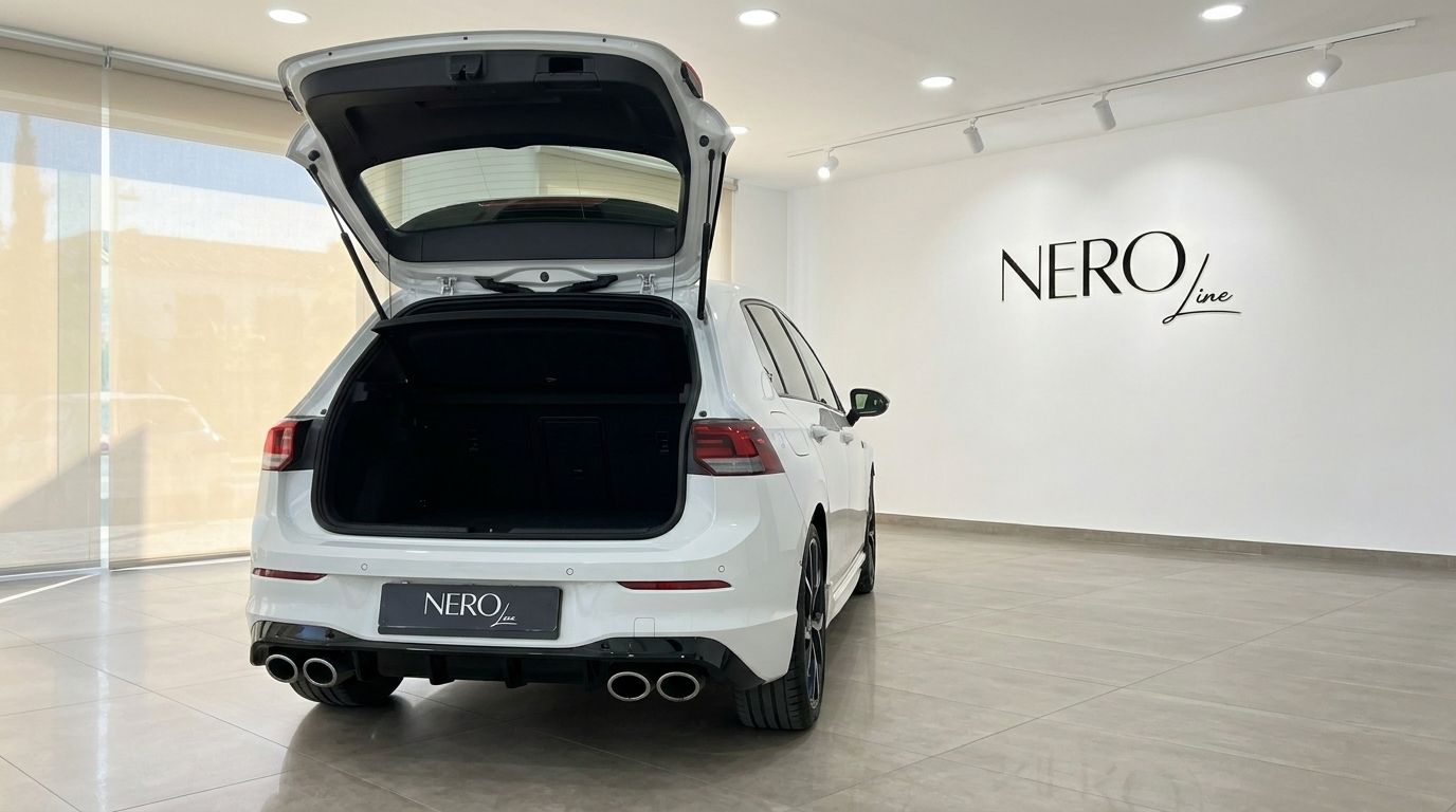 Volkswagen Golf R 2.0 TSI 4MOTION DSG with its trunk open, showcasing the spacious cargo area and quad exhausts in Alicante.